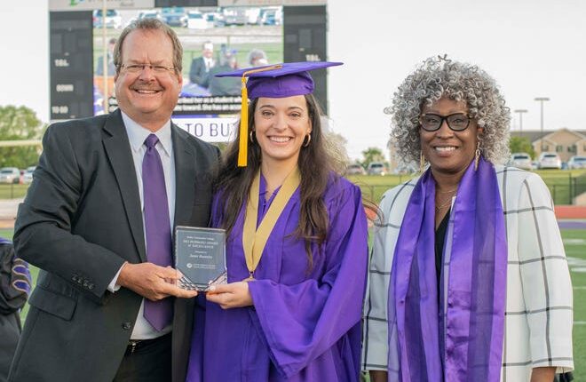 Board of Trustees Rod Young (left) and distinguished 2021 alumna recipient Junetta French Everett (right) presented the Hubbard Award of Excellence to Janet Busenitz (center) at the opening ceremony on May 14, 2021.