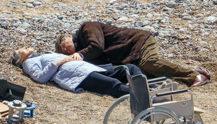 Final scenes: Rupert Everett and Gina McKee - who play older versions of David Dawson and Emma Corrin in the film, were pictured in Sussex during the filming of the final dramatic scenes of the future blockbuster My Policeman
