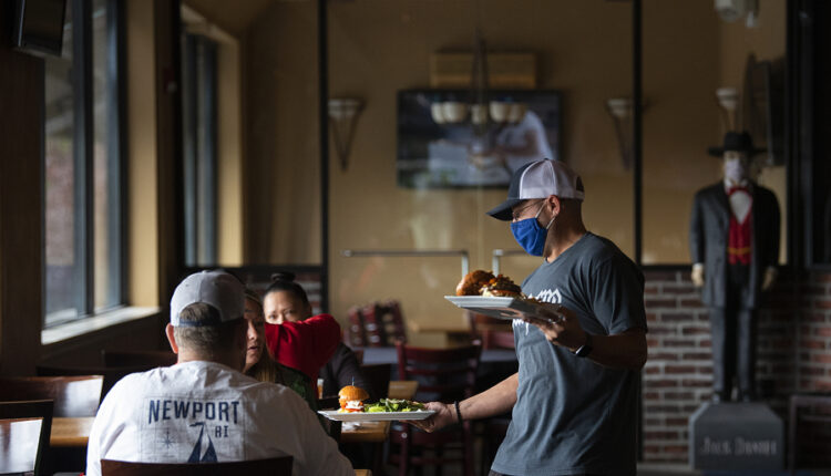 Bartender Mike Dunning serves lunch in the dining room at Main Event East.