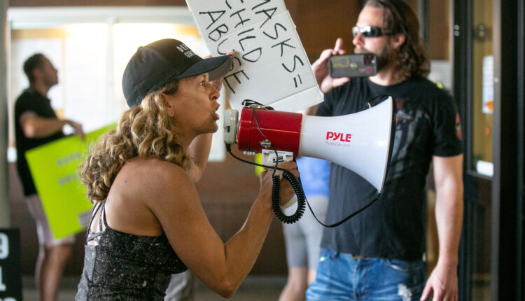 LOS ANGELES, CA - SEPTEMBER 09: Demonstrators opposed to masking and mandatory vaccination for students gather outside the Los Angeles Unified School District headquarters as board members voted that all children 12 and older in Los Angeles public schools must be fully vaccinated against COVID-19 by January to enter campus on Thursday, Sept. 9, 2021 in Los Angeles, CA. This is the first such mandate among the nations largest school systems.(Jason Armond / Los Angeles Times via Getty Images)