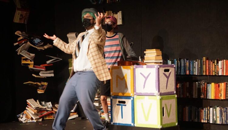 Mr. Wormwood, played by Elias Barnhart, rails against books and in favor of TV (“The bigger the telly, the smarter the man!”), with his favored child Michael, played by Will Barnhart, nodding approval in the rousing first act of “Matilda,” presented by Imagine Theatre in Milwaukie. (Kristen Hannum/Catholic Sentinel)