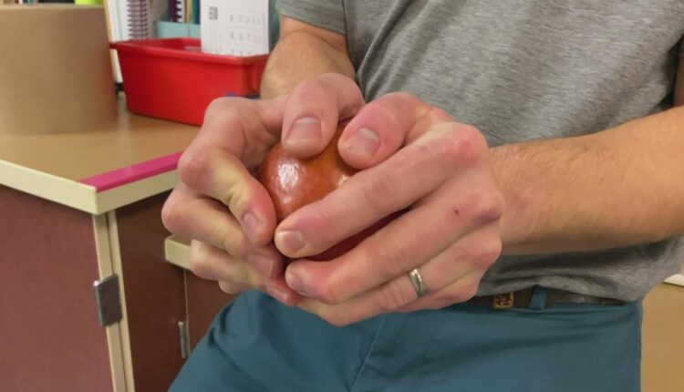 Everett teacher goes viral with apple-splitting trick