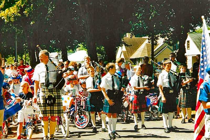 COURTESY OF ENA AND JOANNE CARLSON - The Eastmoreland Fourth of July parade, established in 1994, has included everything from horses, police motorcycles, and Rose Festival Royalty, to clowns, and even bagpipers - as shown here in 2001. But this event is dedicated mainly to kids and bicycle riders.